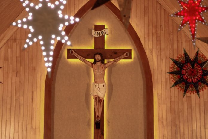 Christian Cross: Representation of the crucifixion of Jesus on large wooden cross.