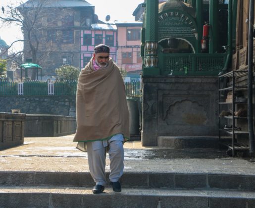 Man walking downstairs inside the Khanqah-E-Maula, Srinagar.