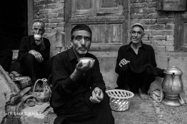 In this picture, mourners are done with procession. Resting and having Kashmiri tea (Noon Chai) in a very traditional manner.