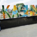 A Man Strikes A Pose In front Of #Kashmir Mural Near Jhelum River Front
